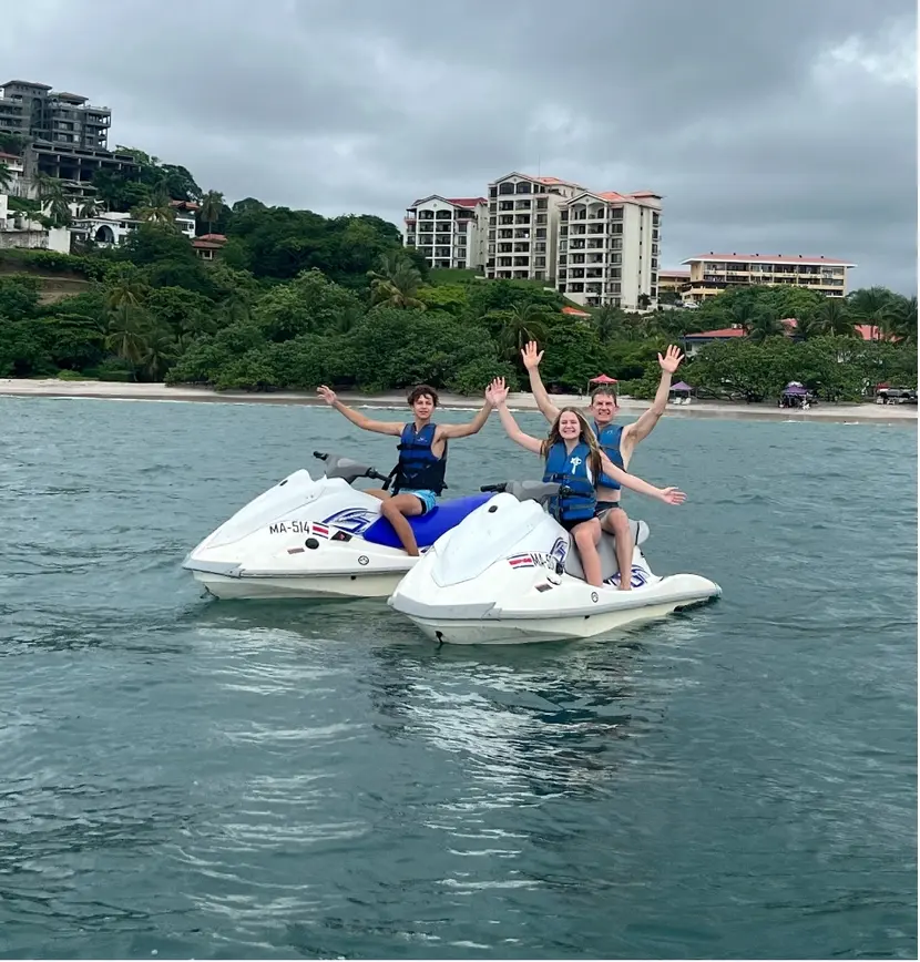 Dr. Parmer with kids on jet ski | Alliance Oral & Maxillofacial Surgery